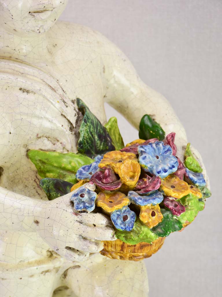 Mid century faience Putto with colorful flowers 26"