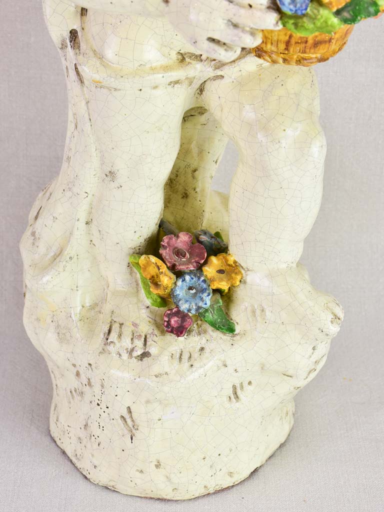 Mid century faience Putto with colorful flowers 26"