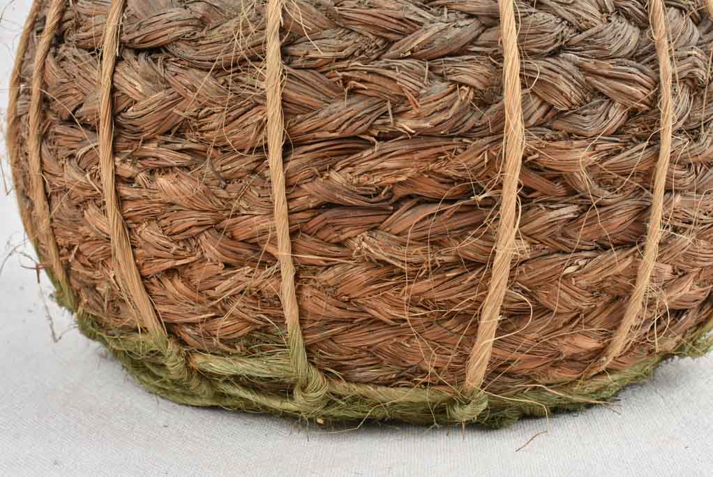 Small demijohn bottle in woven straw basket 13½"
