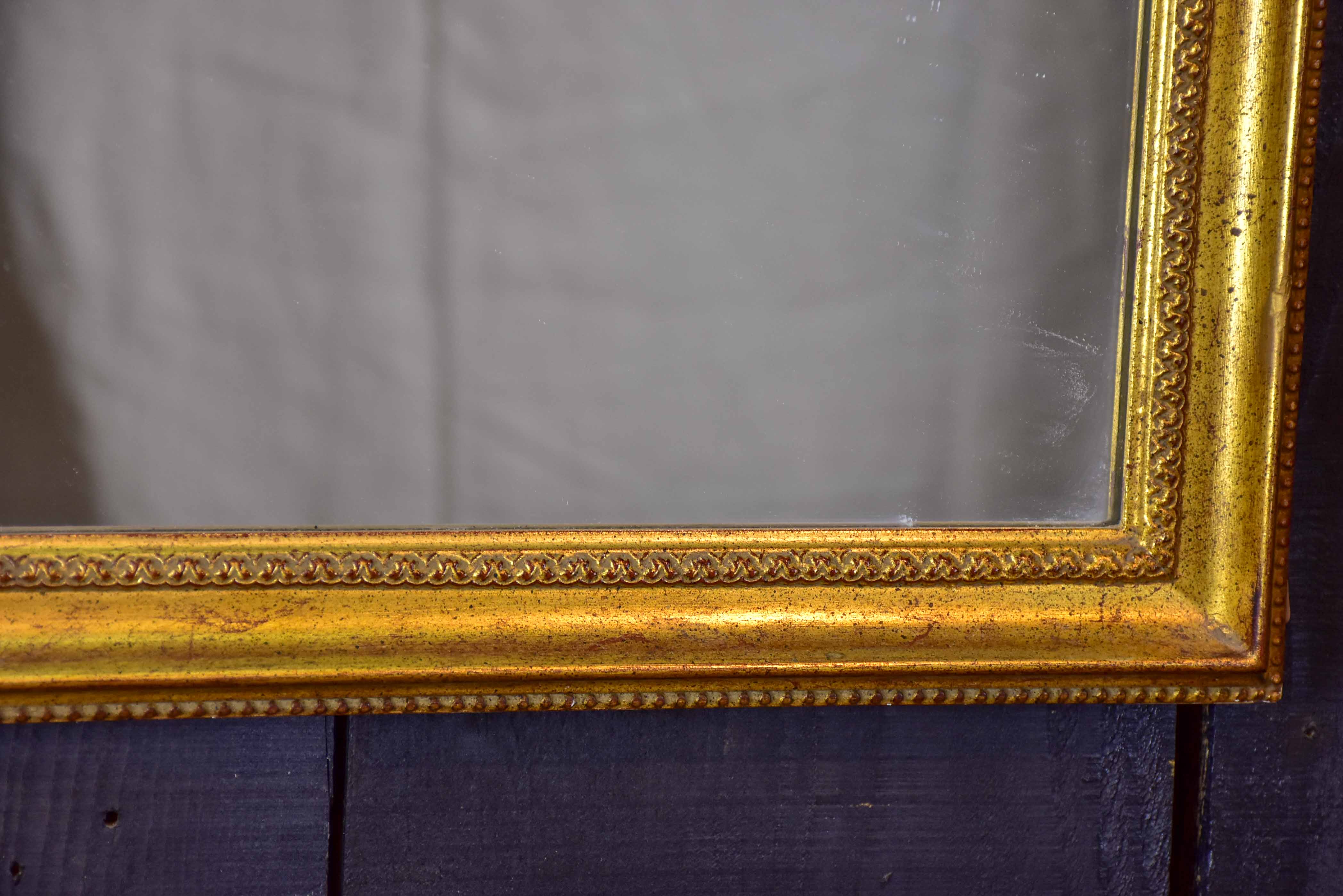 Vintage French arched mirror with gilded frame