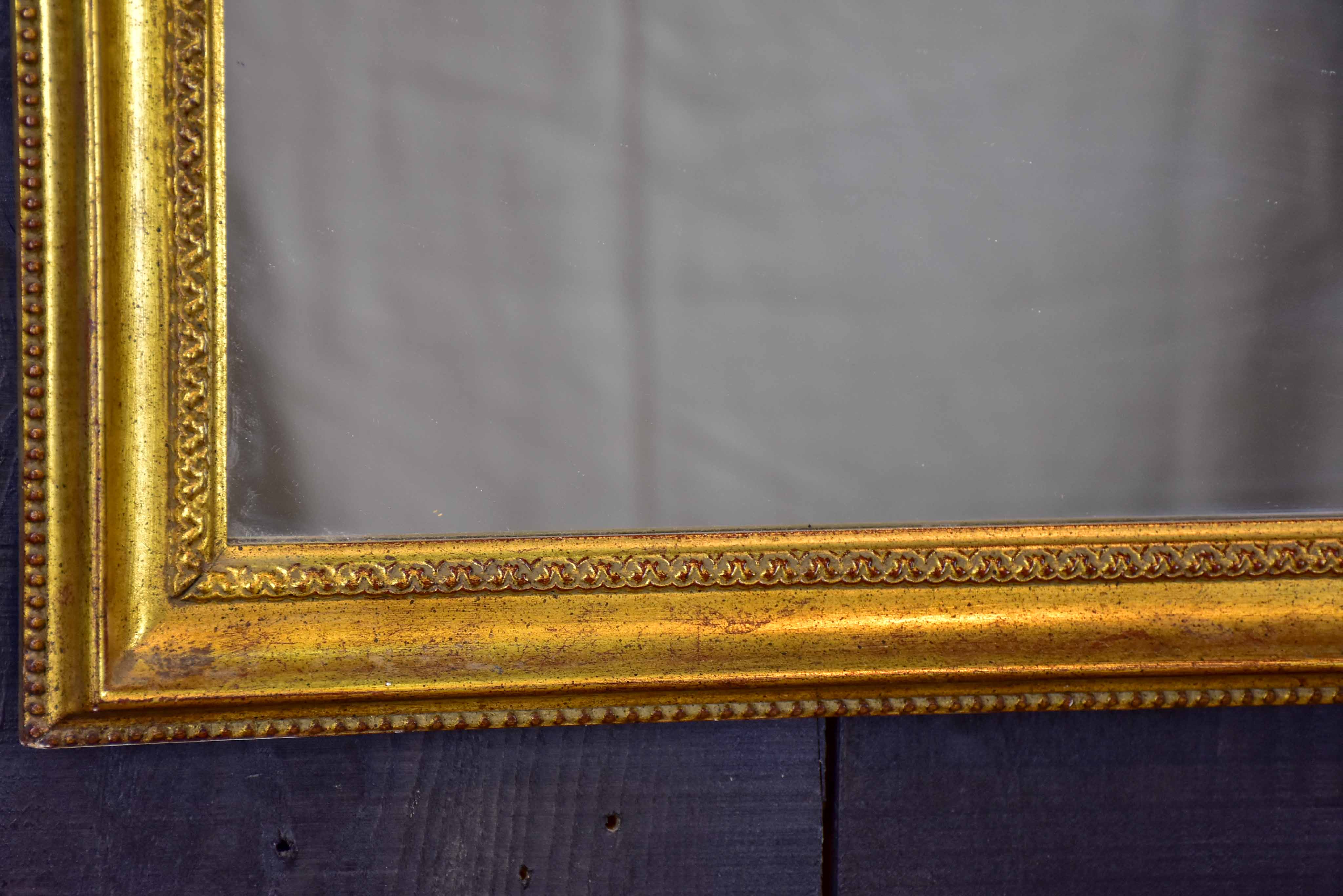 Vintage French arched mirror with gilded frame