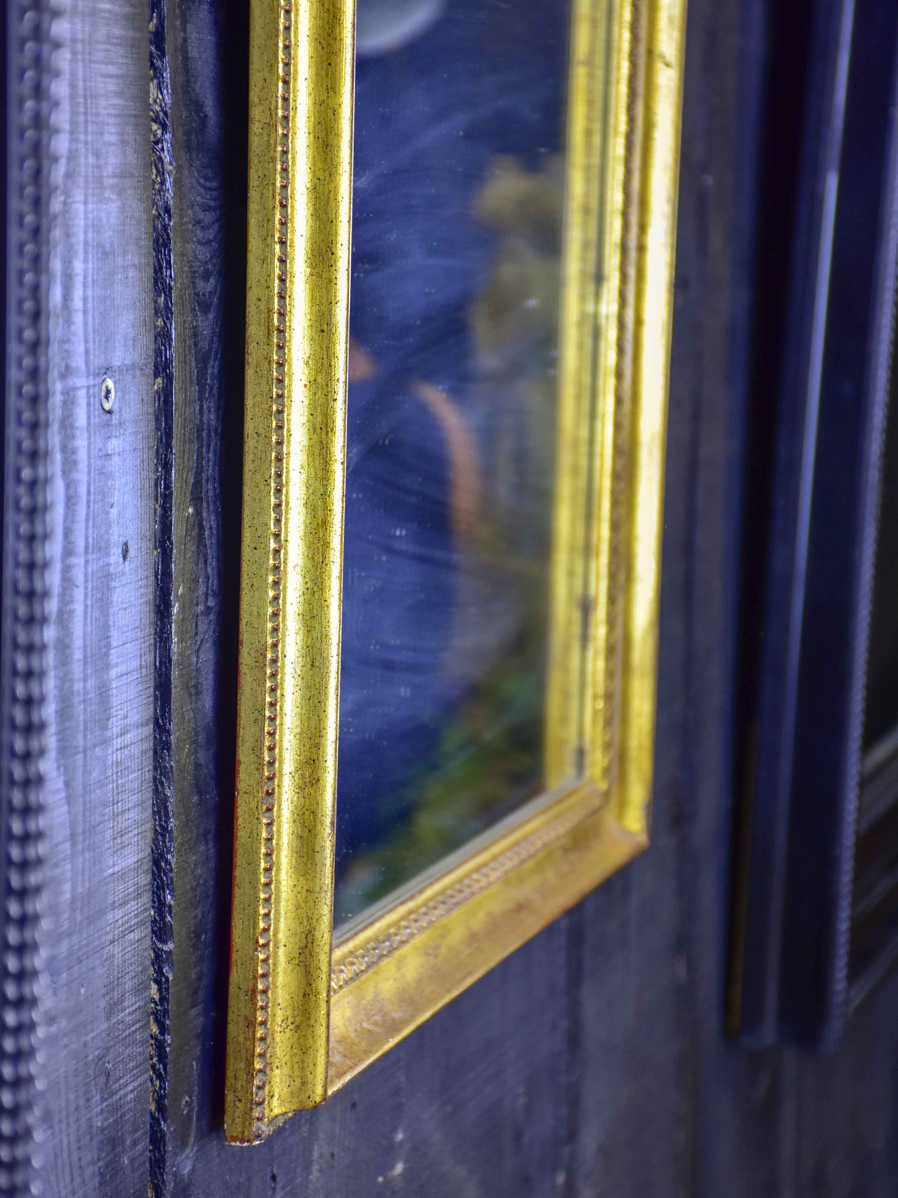 Vintage French arched mirror with gilded frame