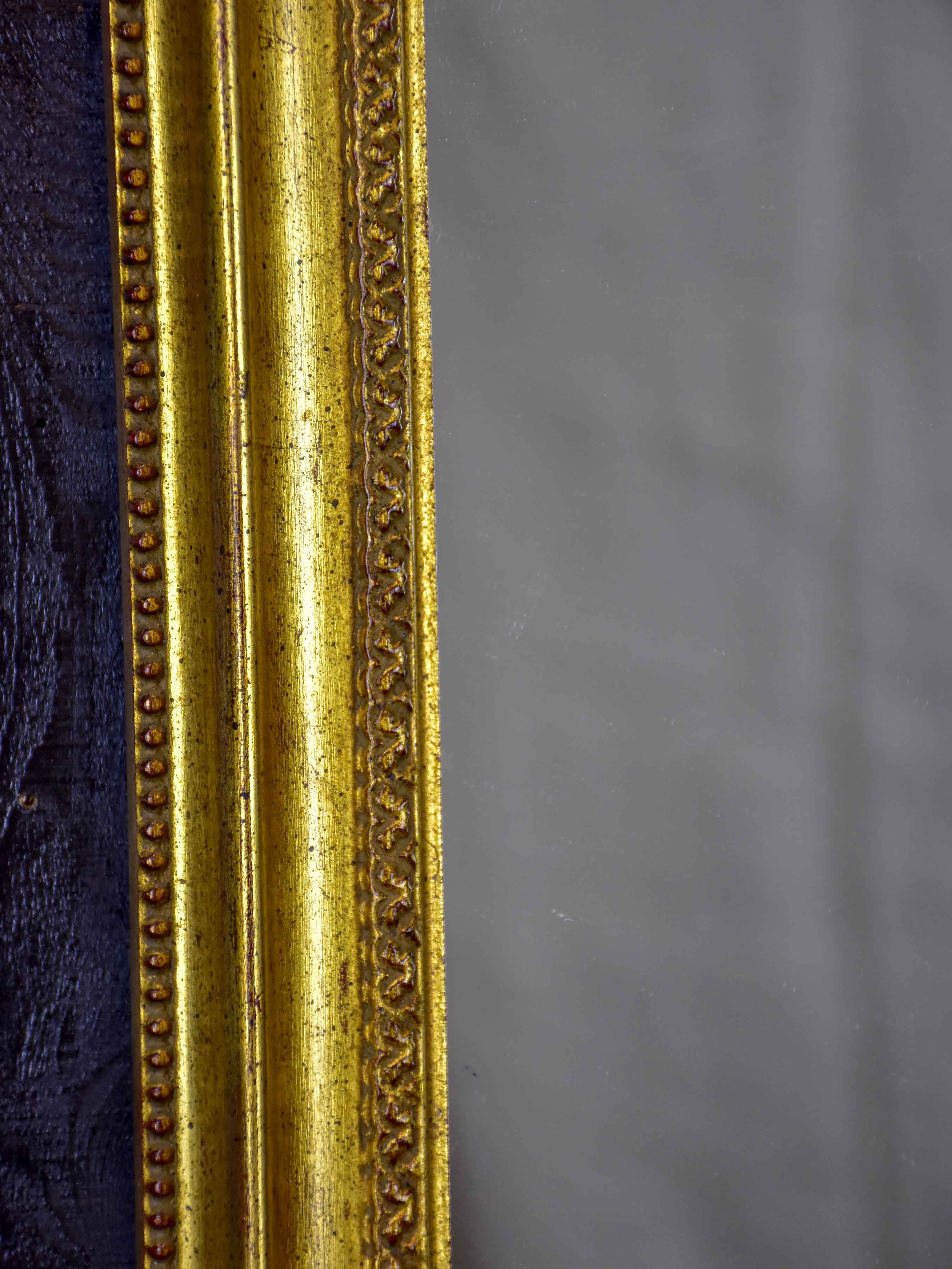Vintage French arched mirror with gilded frame