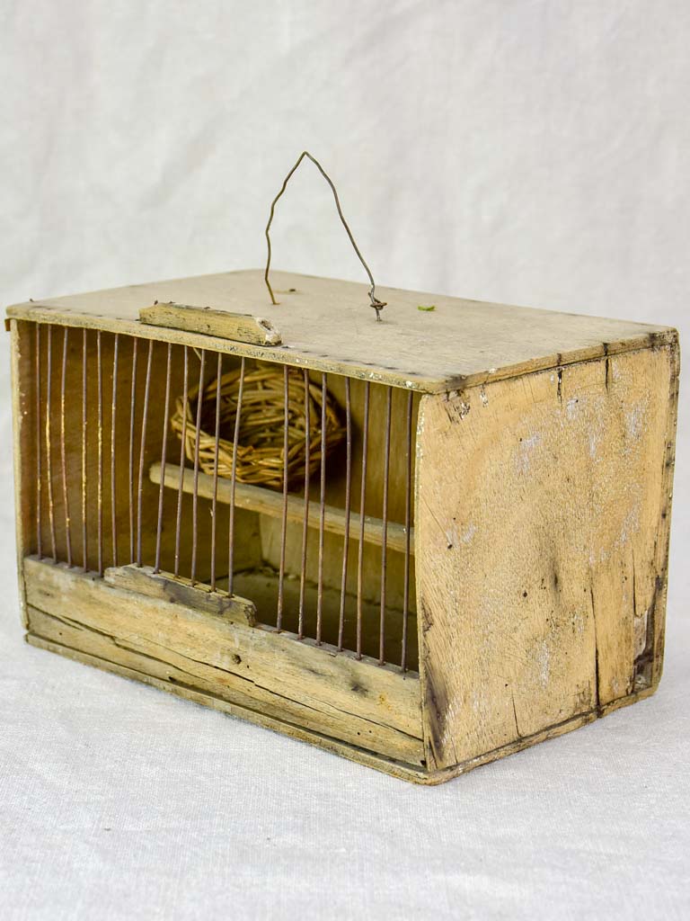 Small 1920's birdcage with nest and water