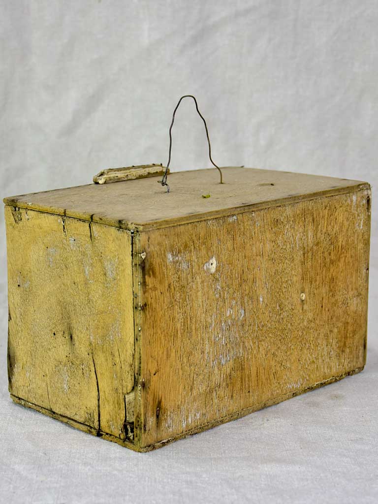 Small 1920's birdcage with nest and water