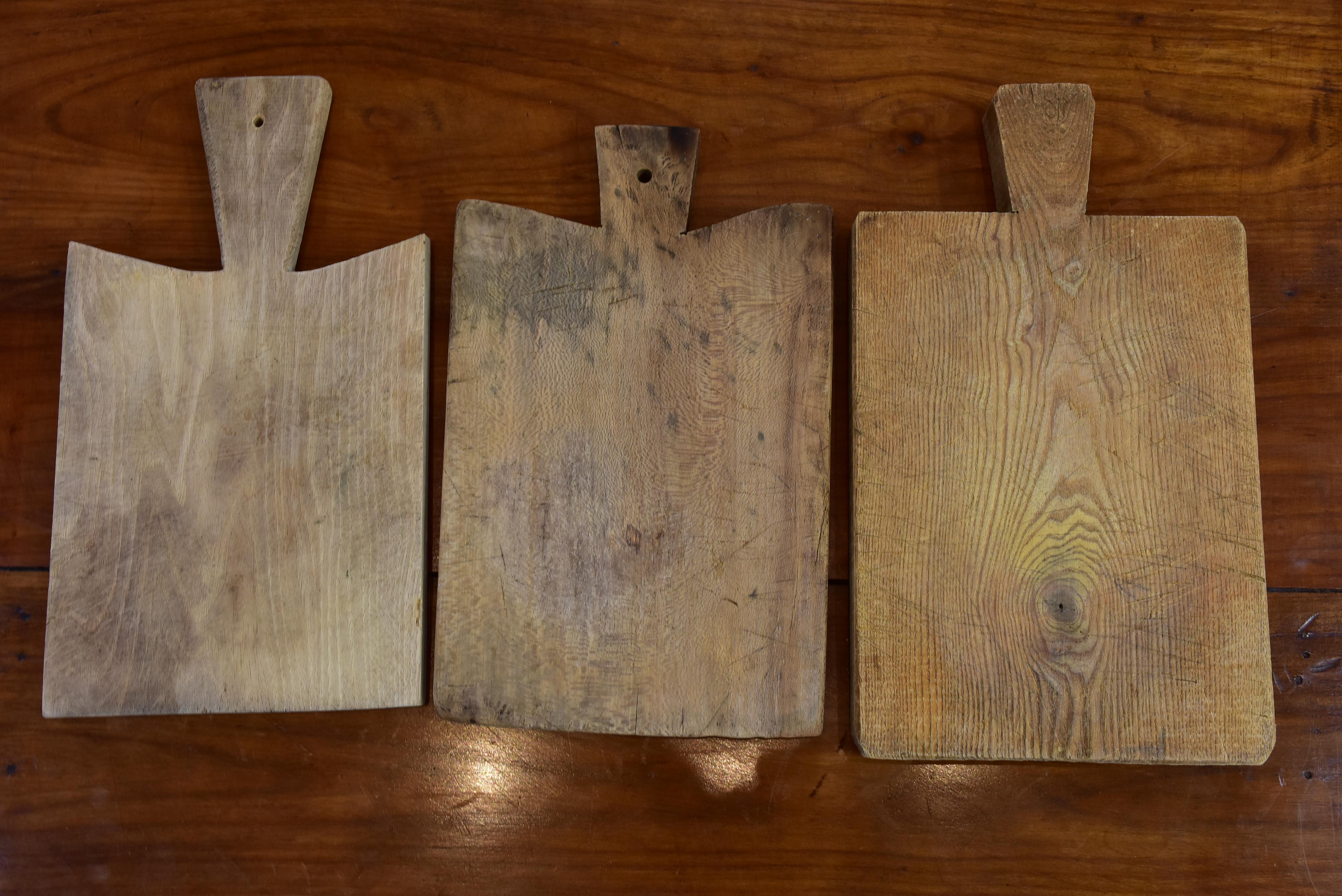 Three rustic French cutting boards