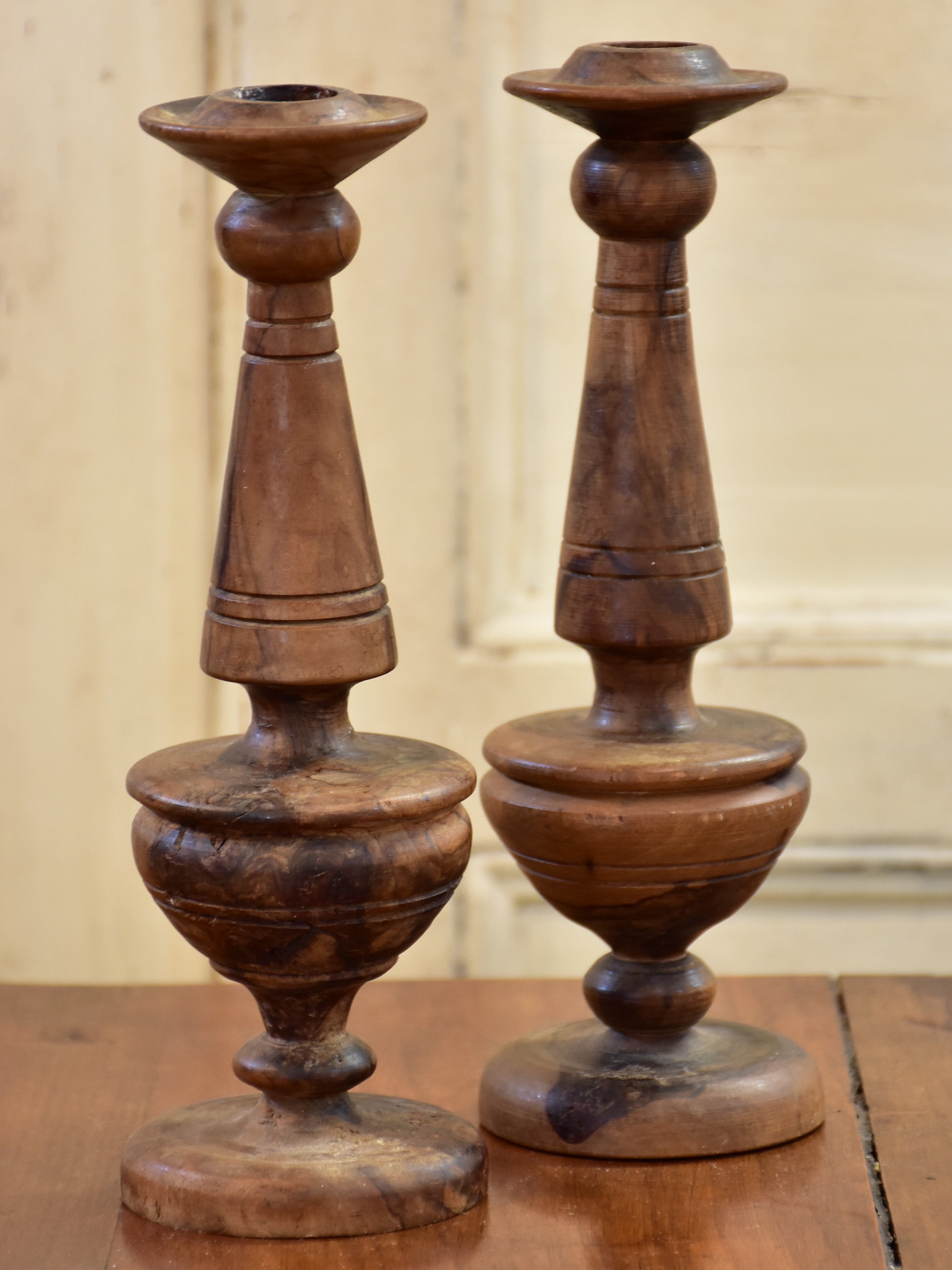 Pair of antique olivewood candlesticks