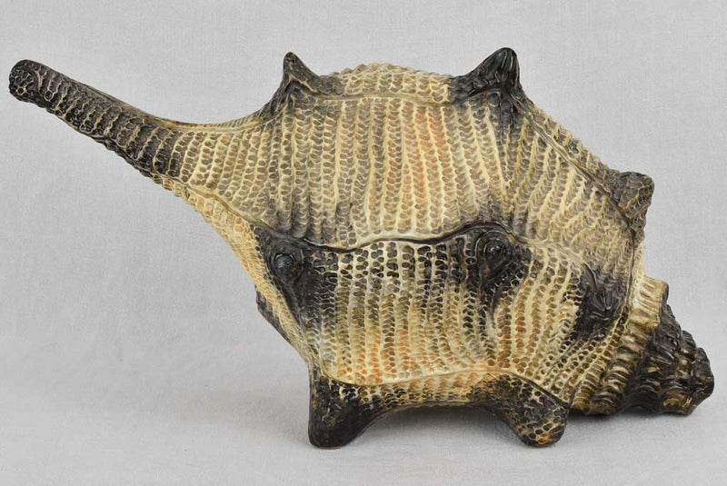 Aged ceramic sculpture with sea creatures