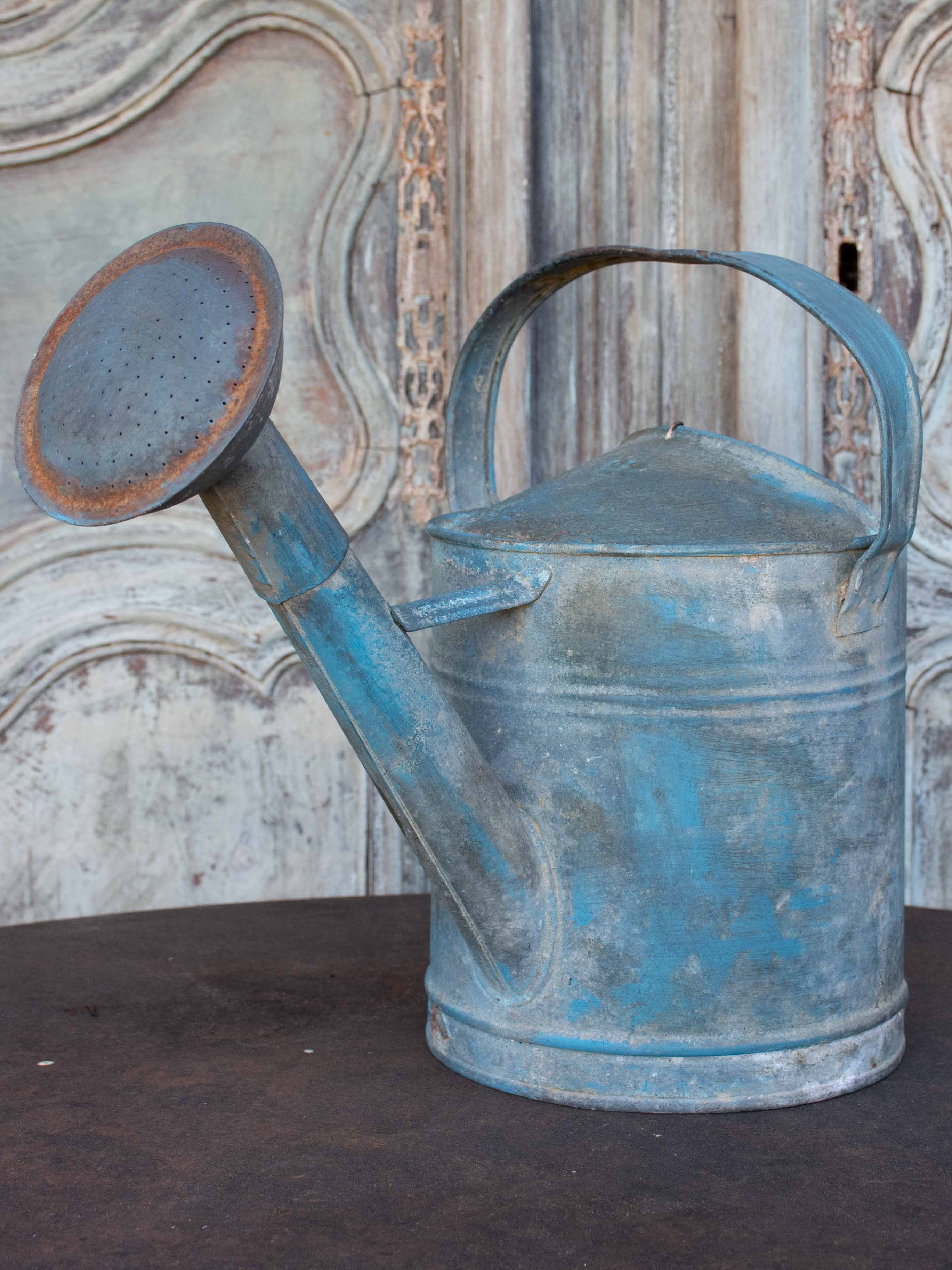 Antique French watering can with blue patina