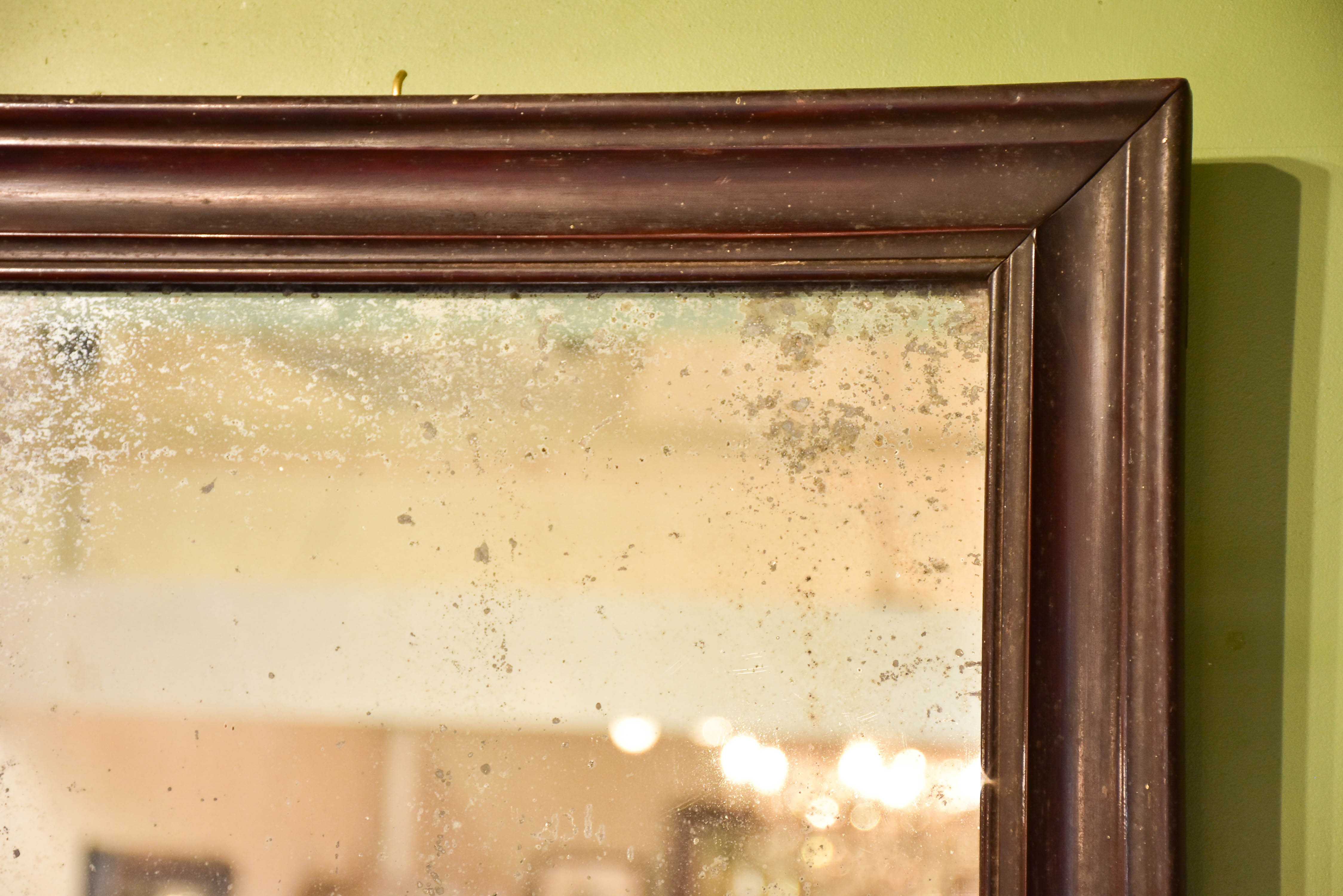 Late 19th century French mirror with black frame