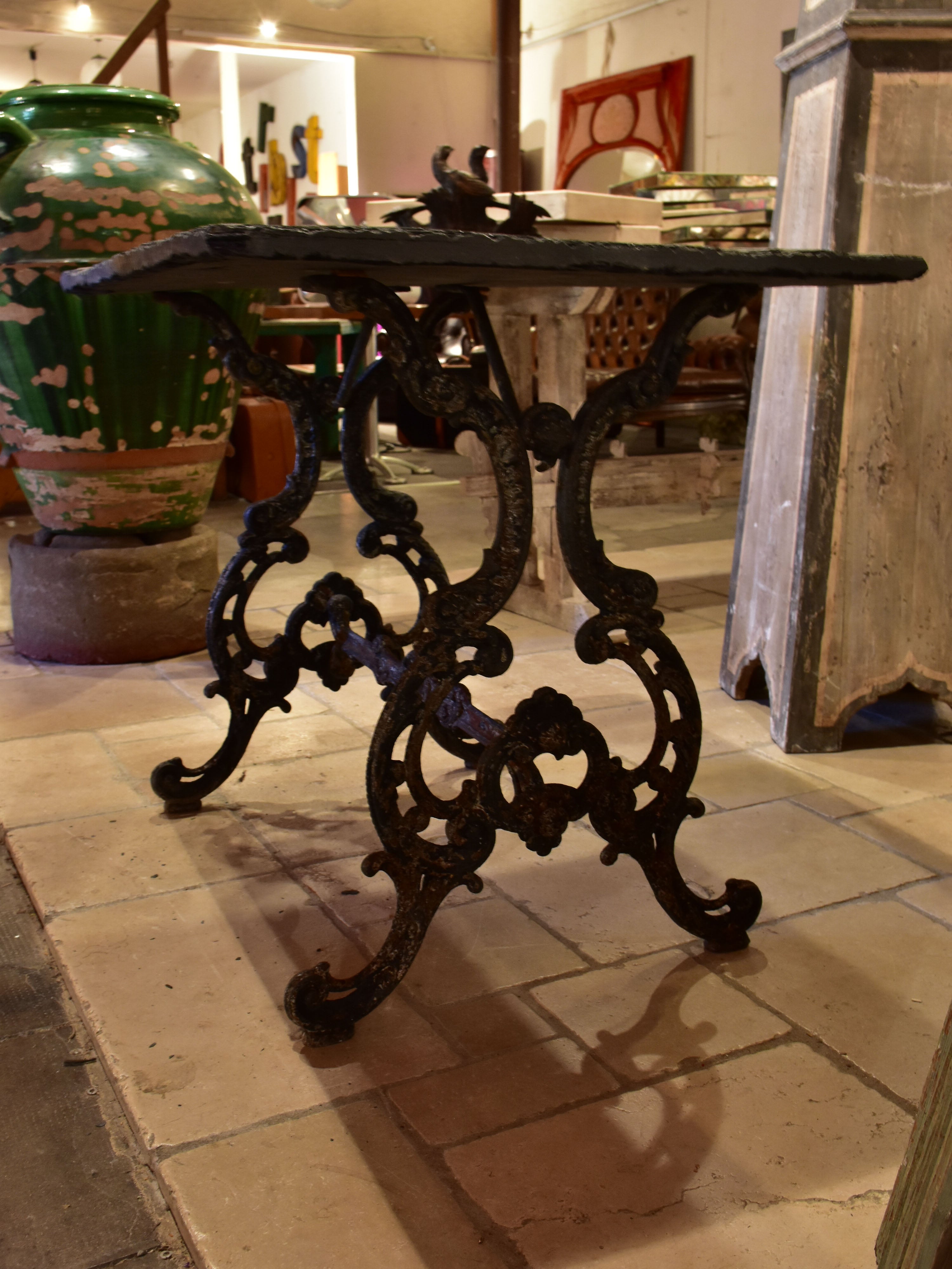 Antique French garden table with slate top and decorative cast iron base
