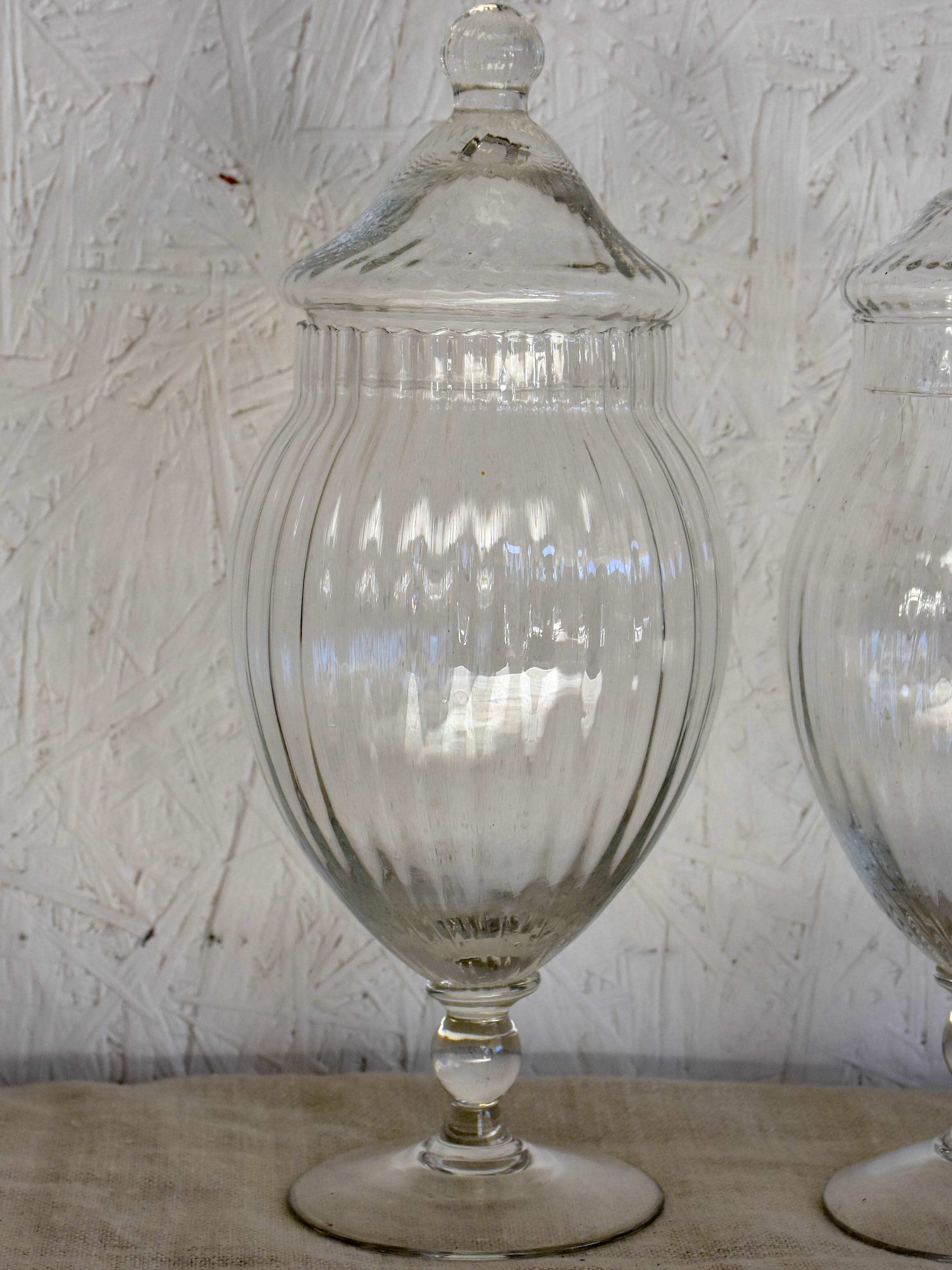 Three vintage French glass vanity jars with lids