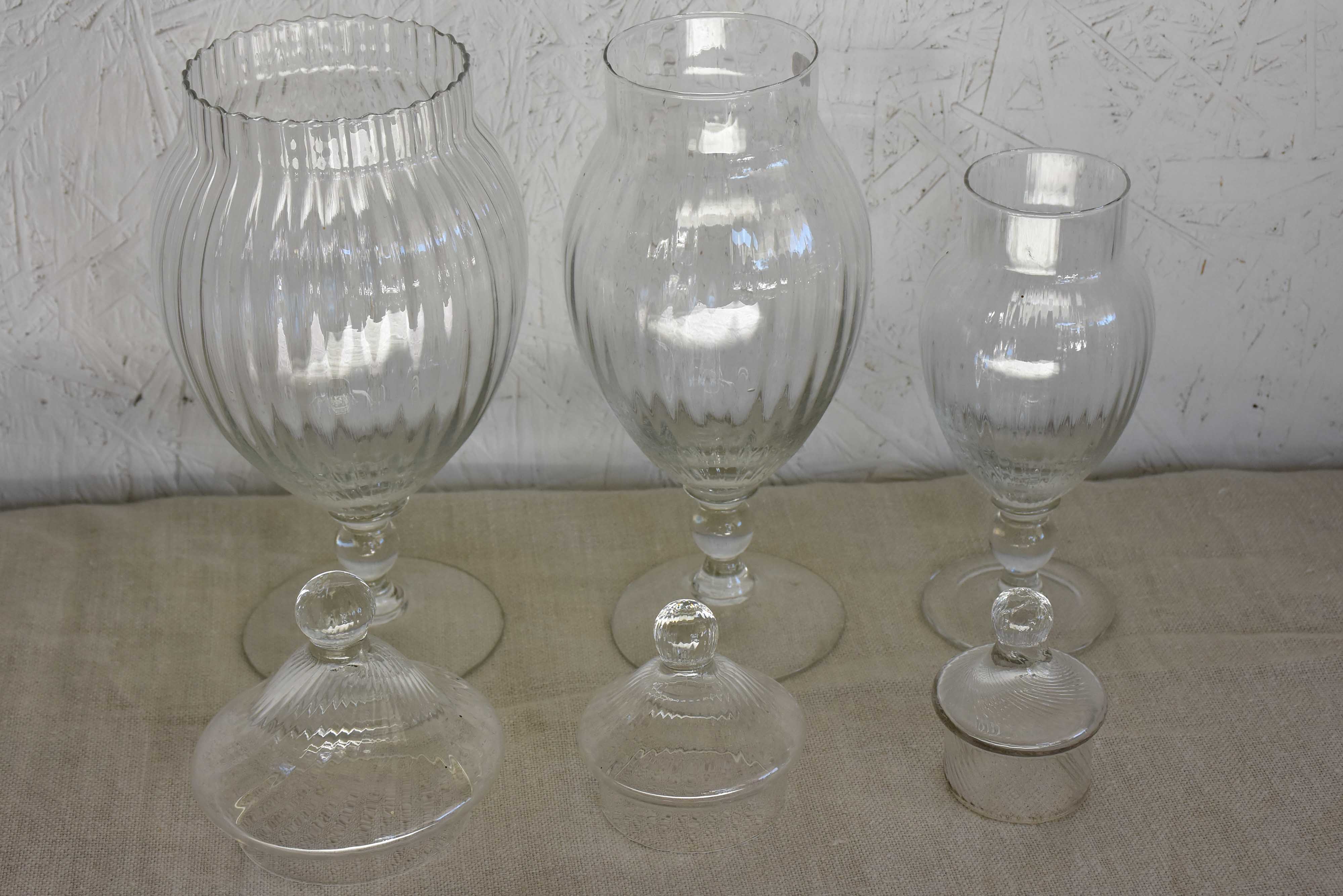 Three vintage French glass vanity jars with lids