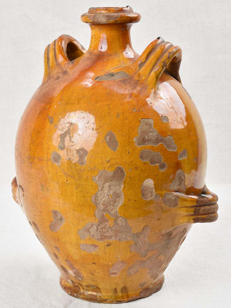 Ochre glazed conscience jug with 4 handles 14½"