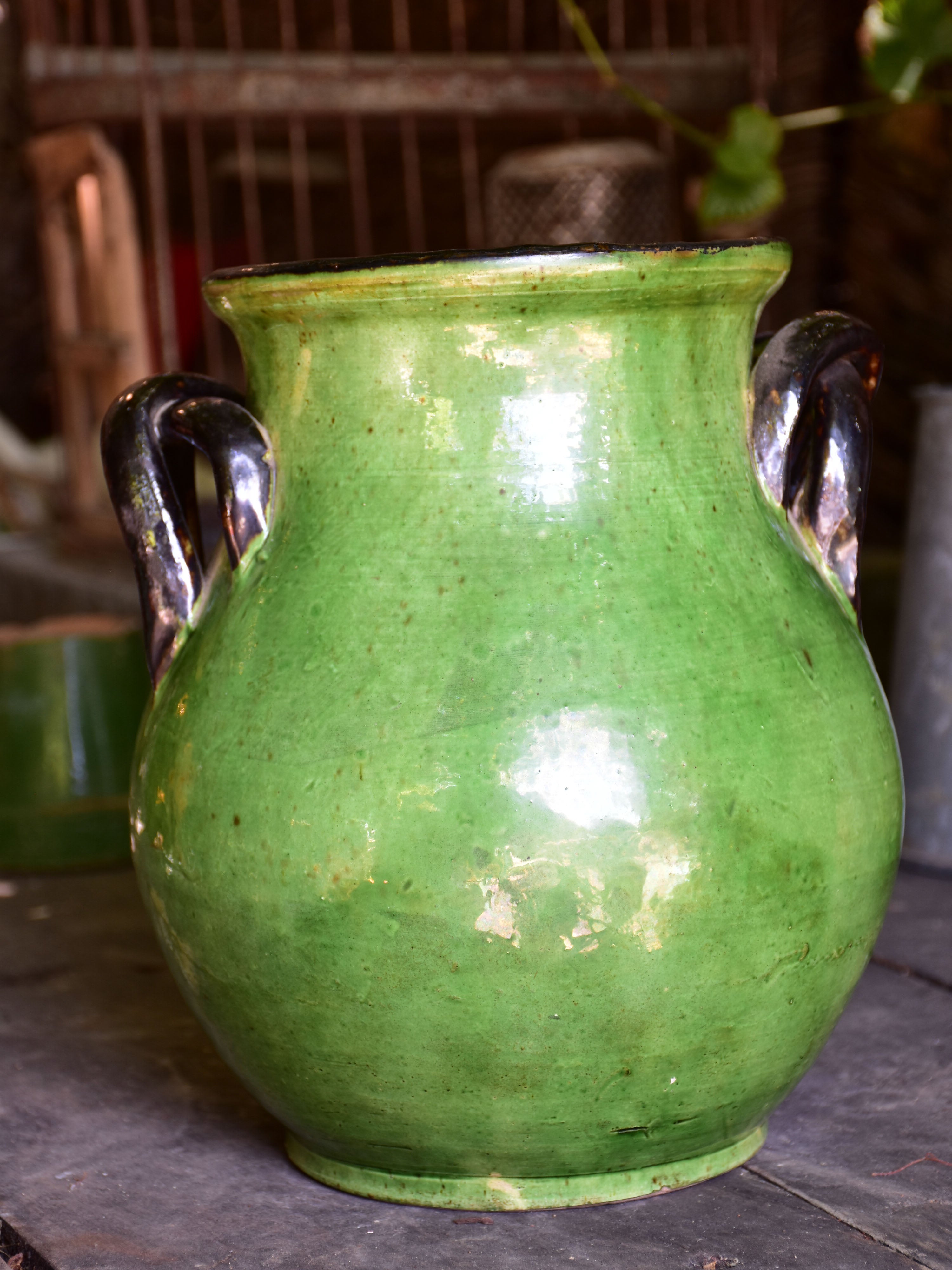 Rare green glazed vase with pretty black handles from the Ardeche