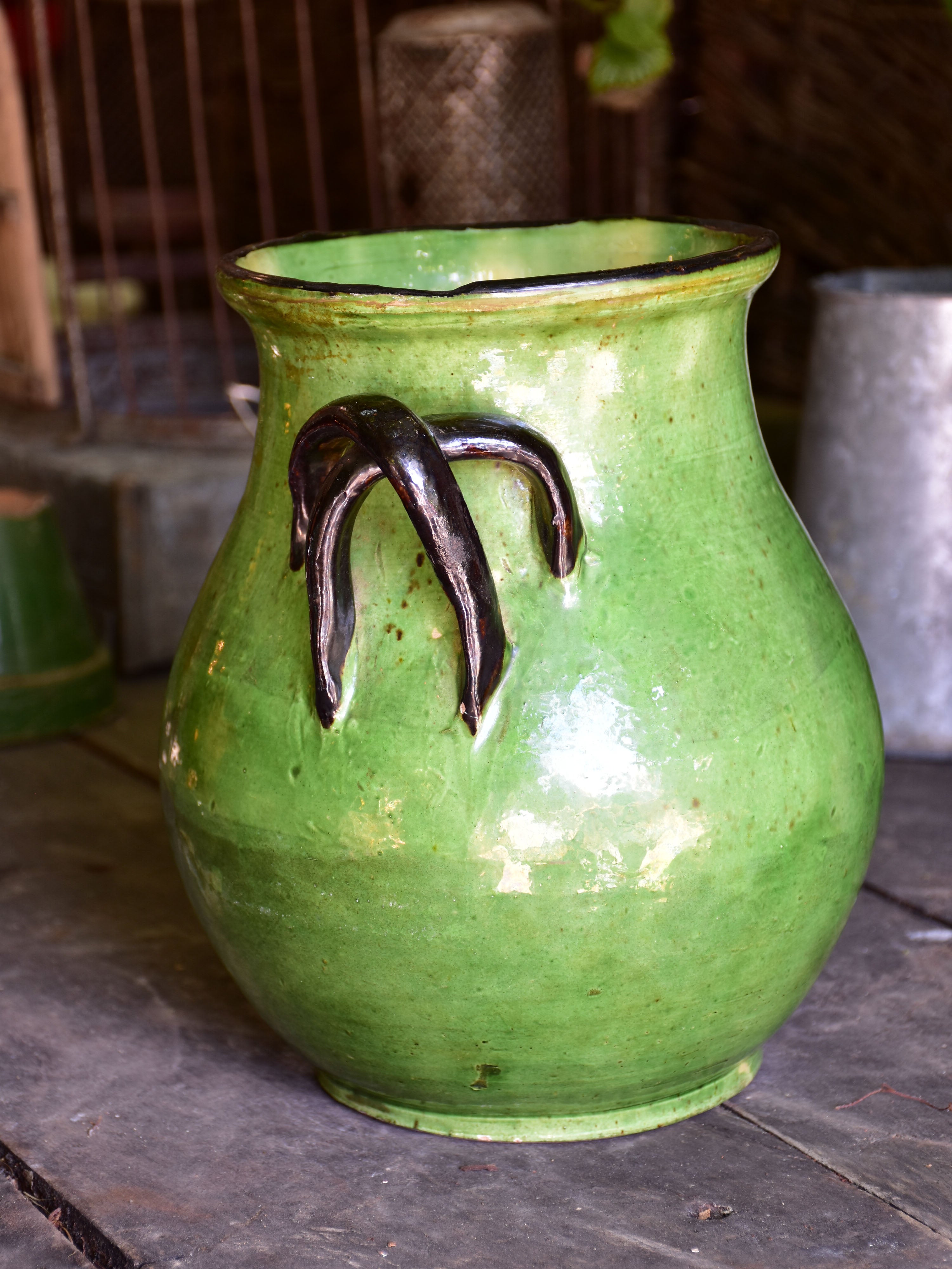 Rare green glazed vase with pretty black handles from the Ardeche