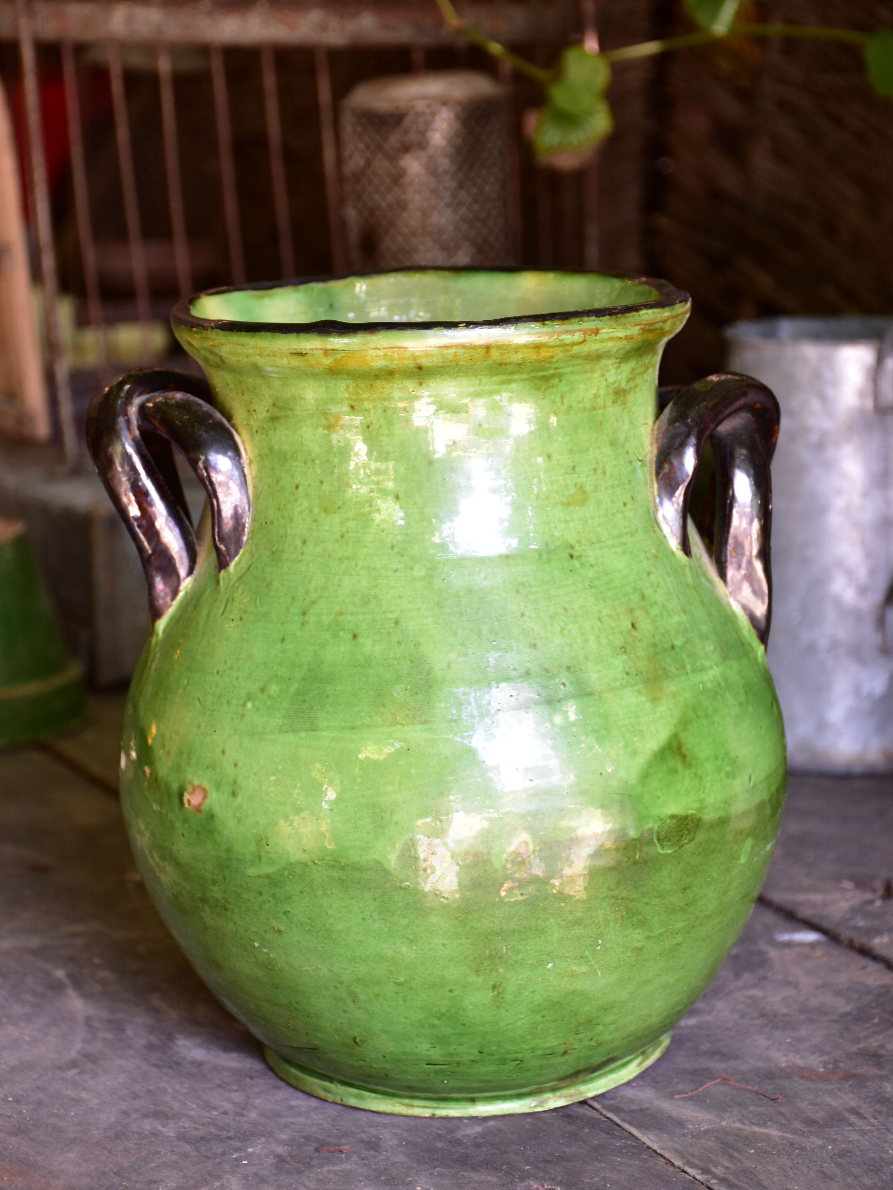 Rare green glazed vase with pretty black handles from the Ardeche