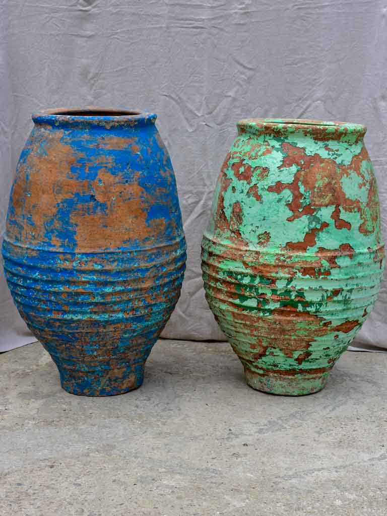 Very large antique Spanish olive oil jar with green patina