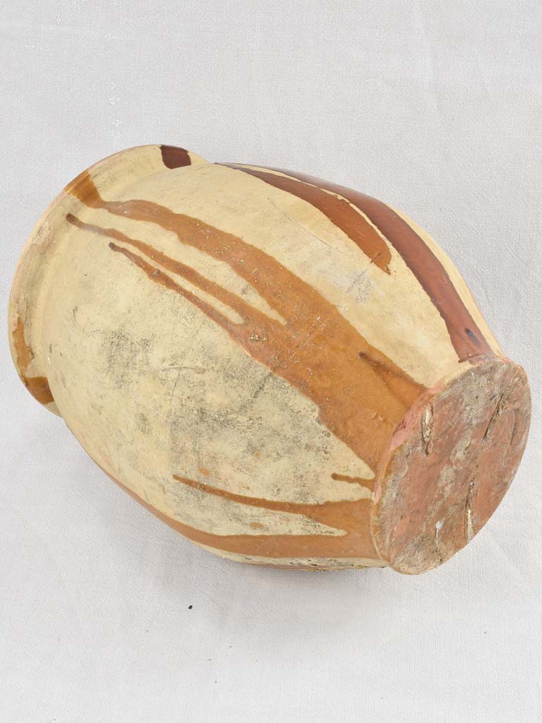 Aged olive jar with glaze drips