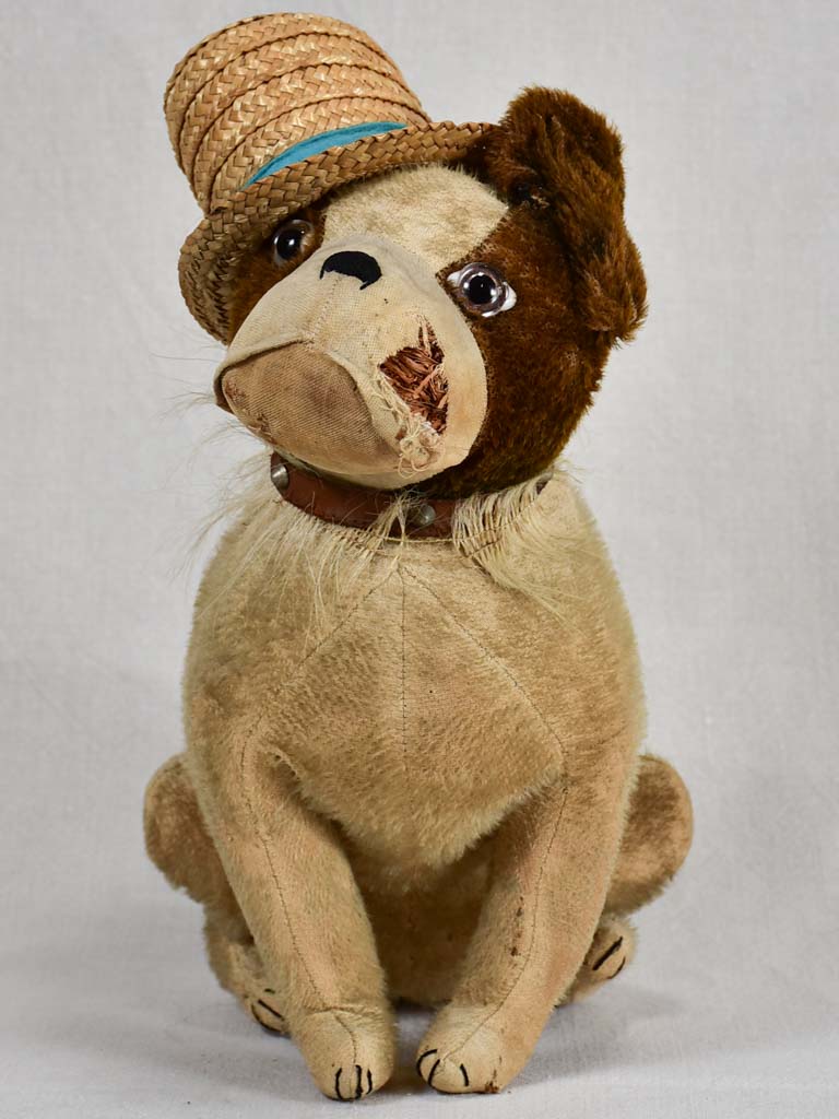 Early 20th-century toy dog with a hat