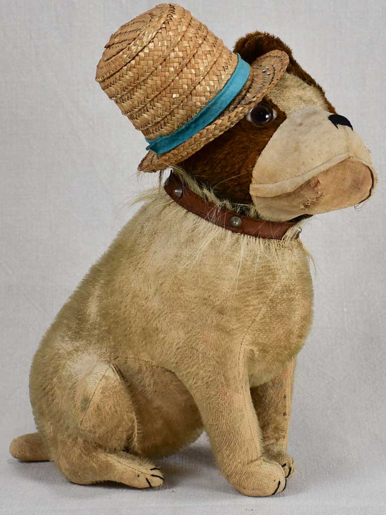 Early 20th-century toy dog with a hat