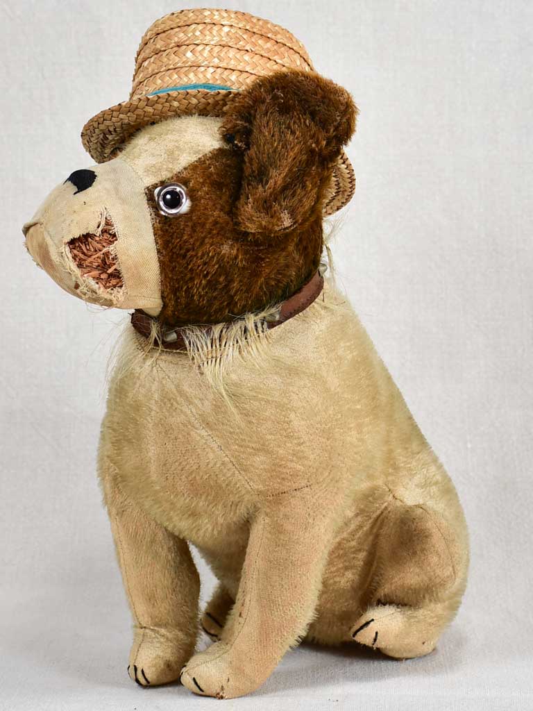 Early 20th-century toy dog with a hat