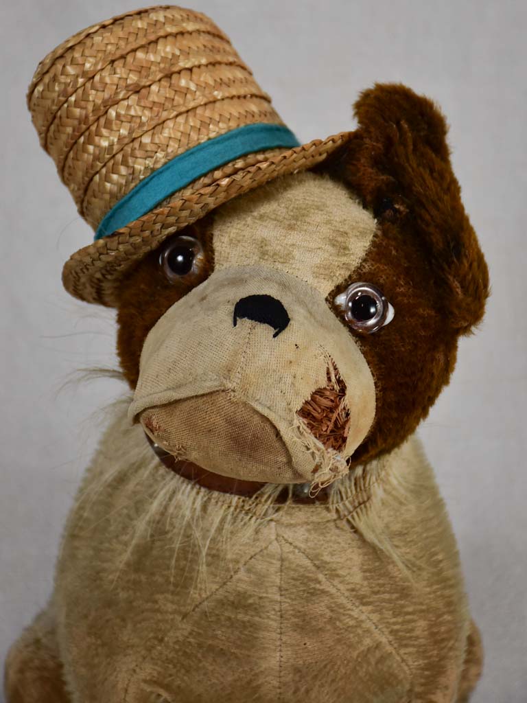 Early 20th-century toy dog with a hat
