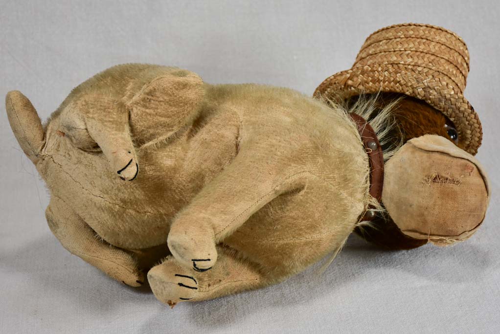 Early 20th-century toy dog with a hat