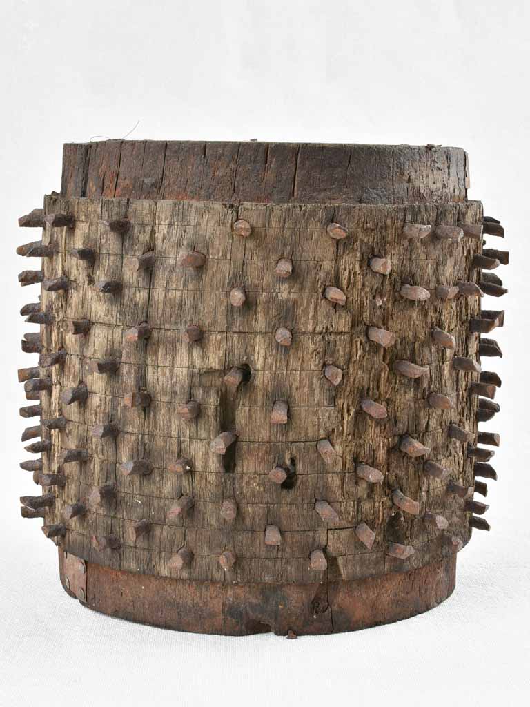Antique salvaged wooden wheel with metal spikes 9"