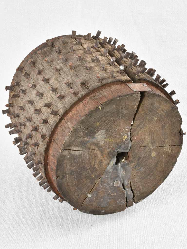 Antique salvaged wooden wheel with metal spikes 9"
