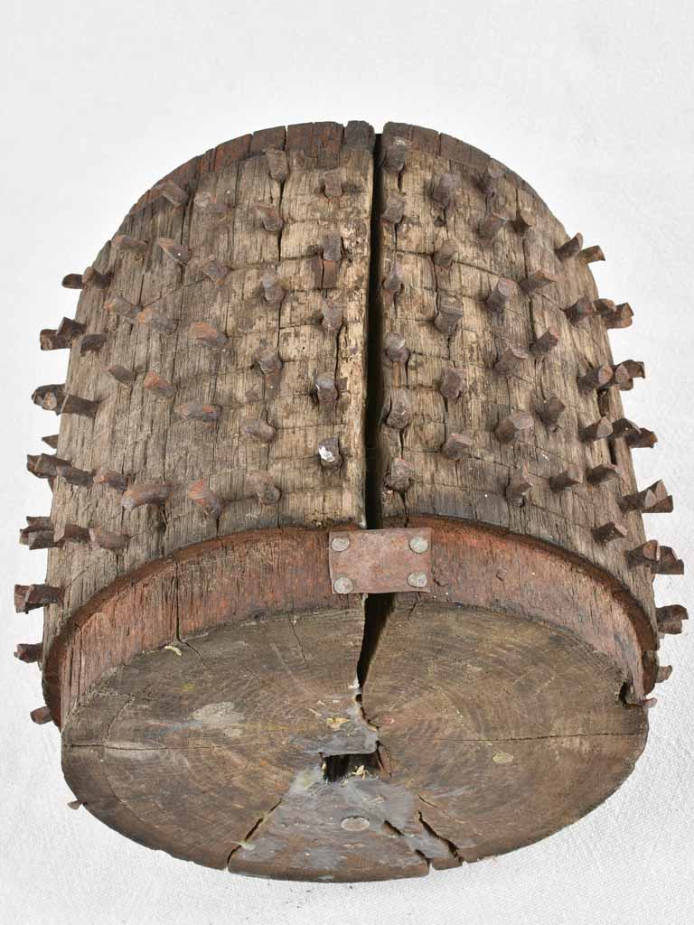 Antique salvaged wooden wheel with metal spikes 9"