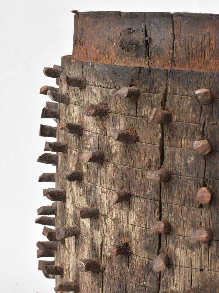 Antique salvaged wooden wheel with metal spikes 9"