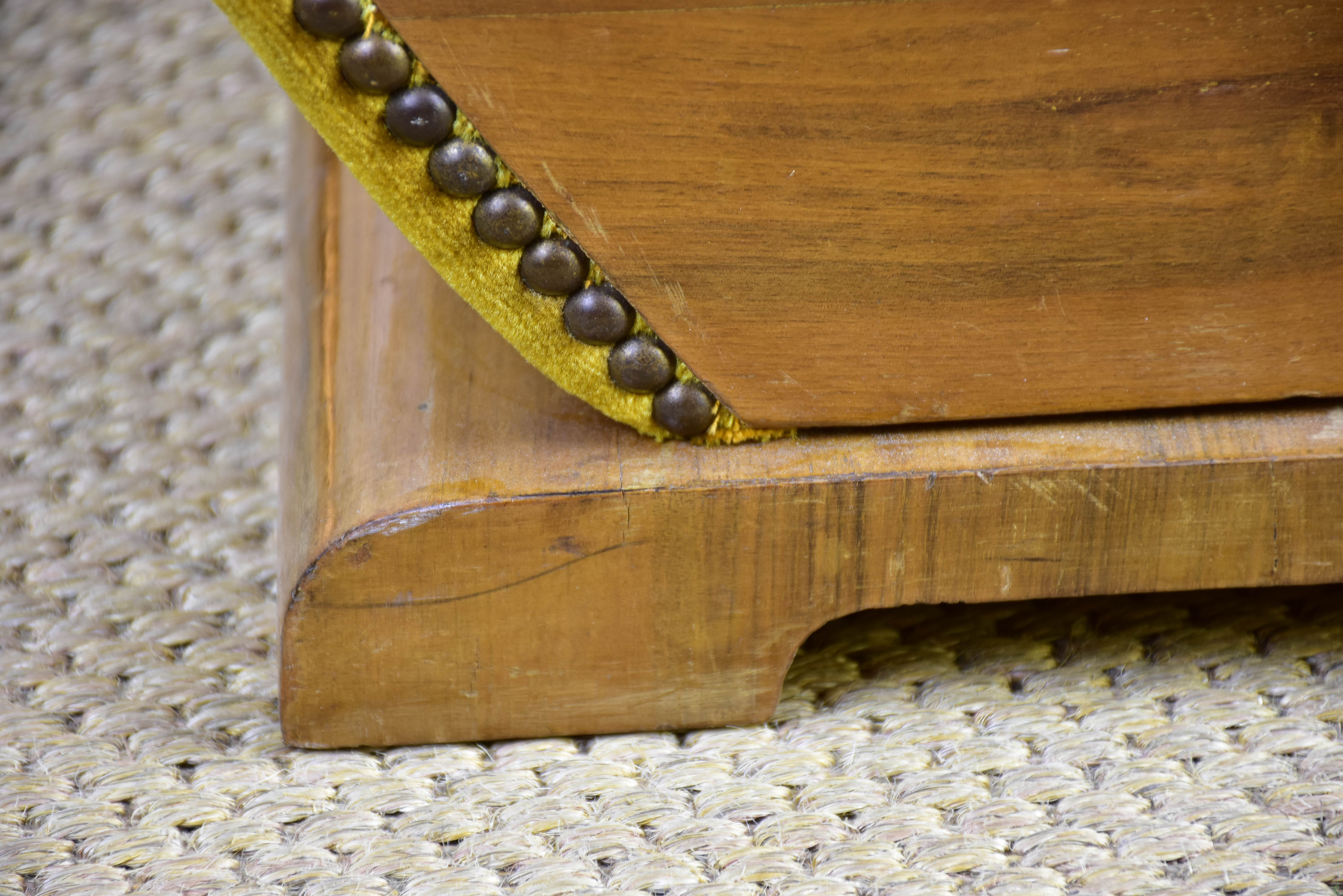 Antique footrest with mustard velvet upholstery
