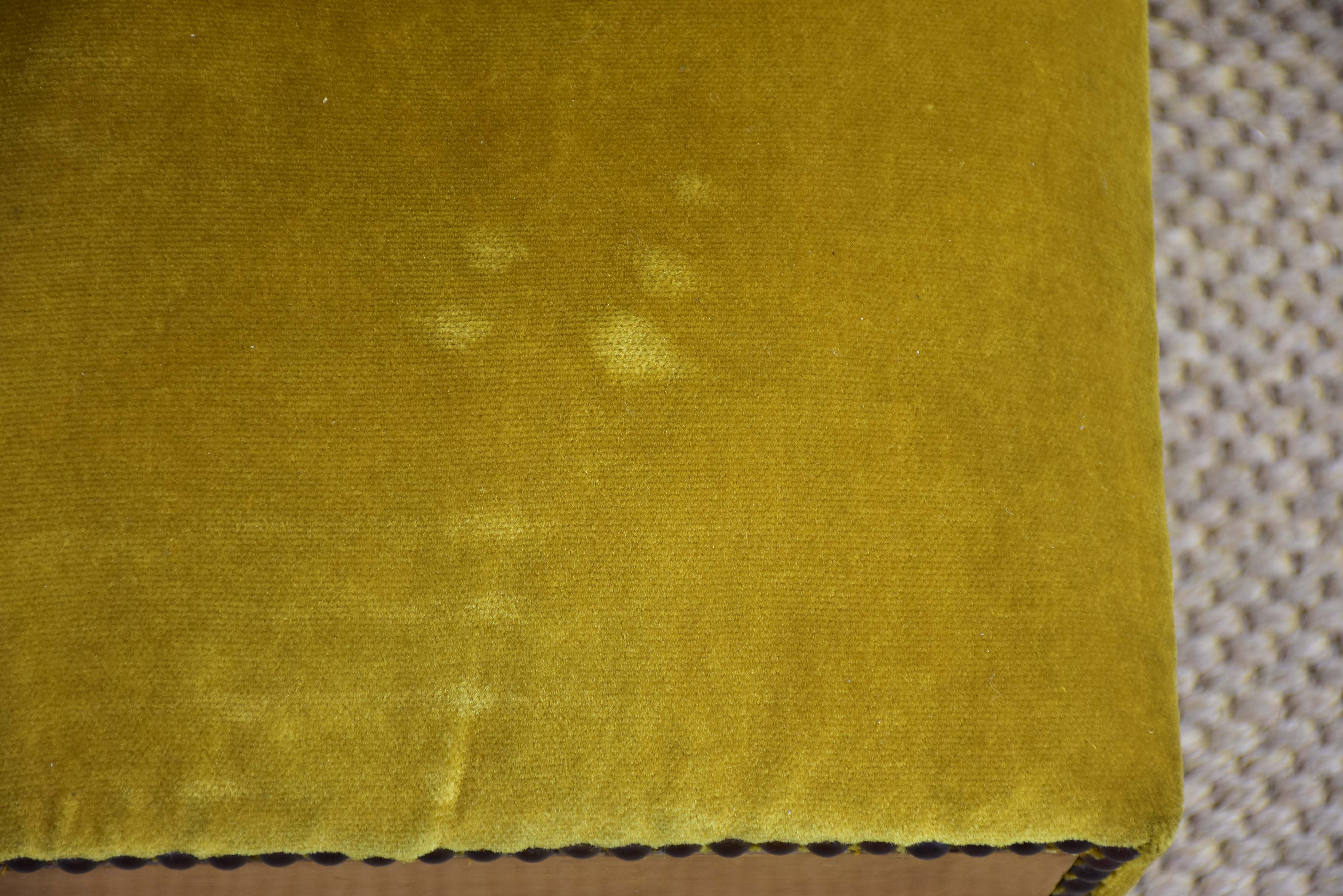 Antique footrest with mustard velvet upholstery