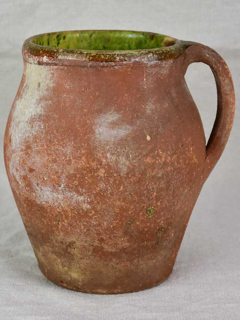 19th century French pitcher with green glaze inside 8"