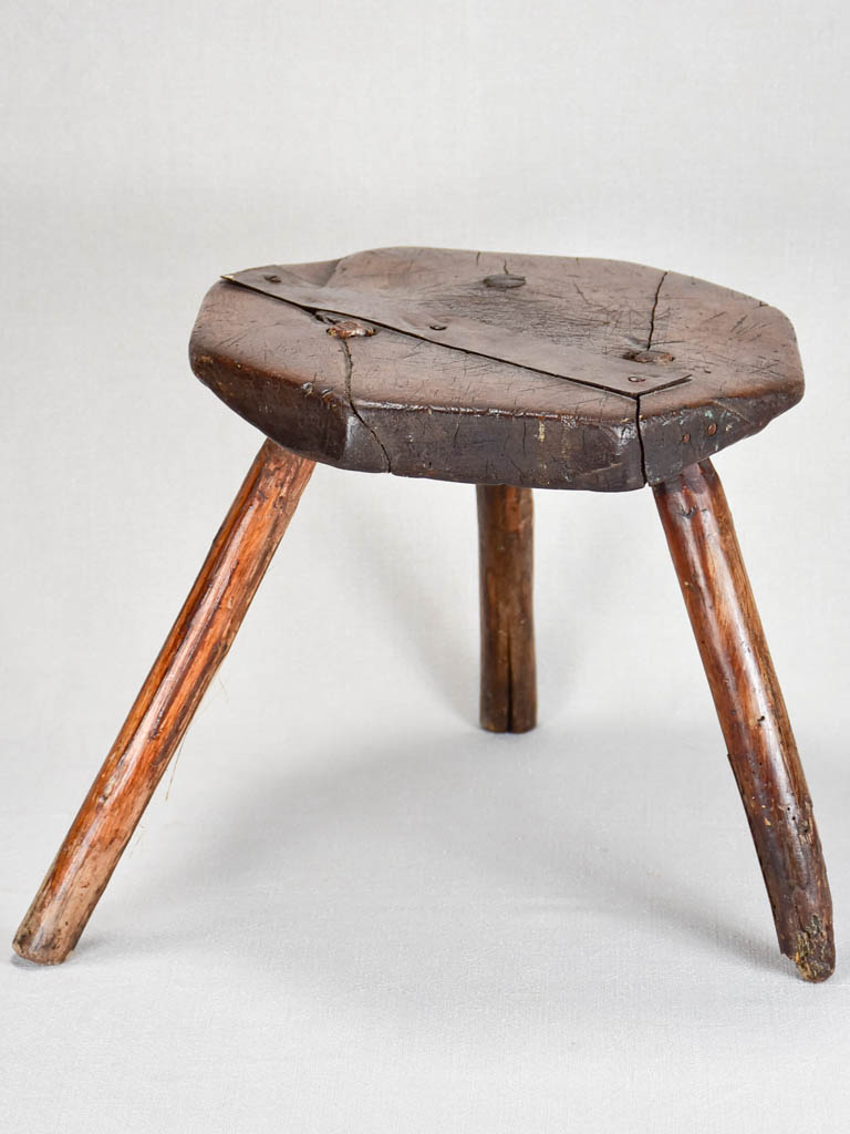 Primitive antique French milking stool with old repairs 13½"