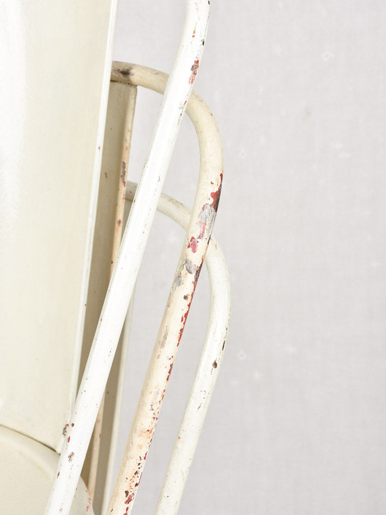 Four 1950s Tolix chairs w/ beige paint finish