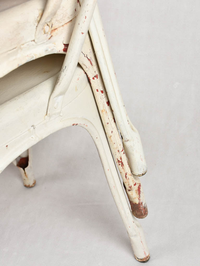 Four 1950s Tolix chairs w/ beige paint finish