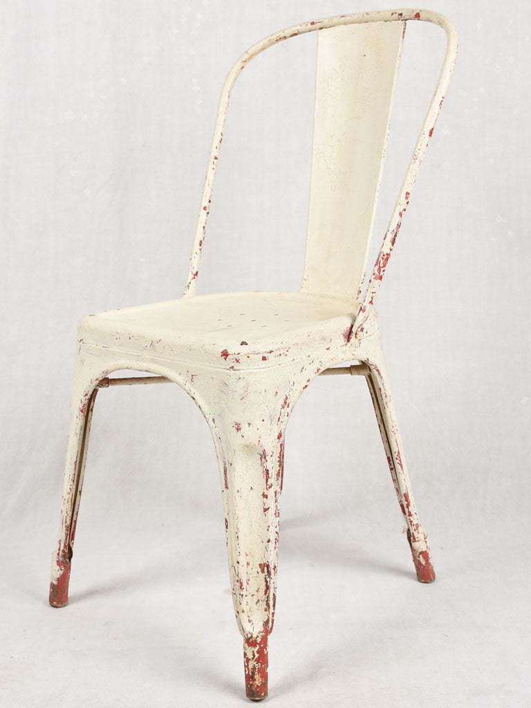 Four 1950s Tolix chairs w/ beige paint finish