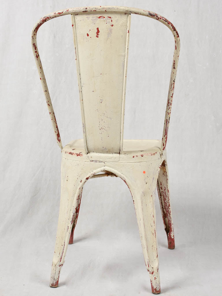 Four 1950s Tolix chairs w/ beige paint finish