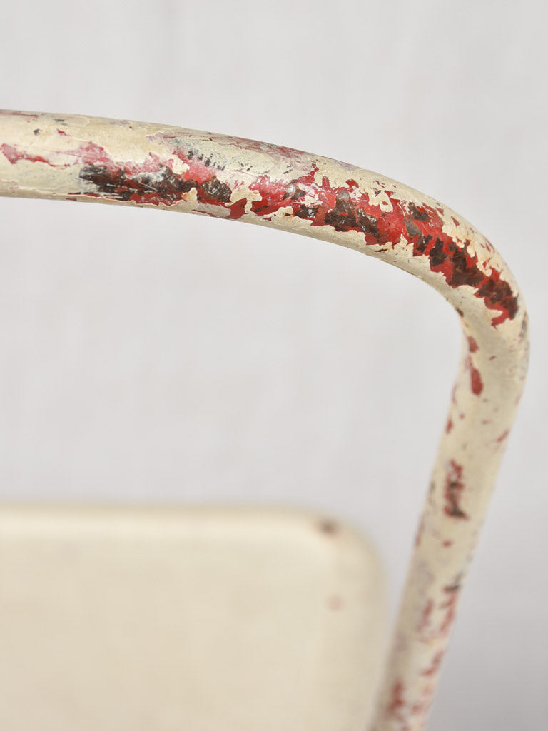Four 1950s Tolix chairs w/ beige paint finish