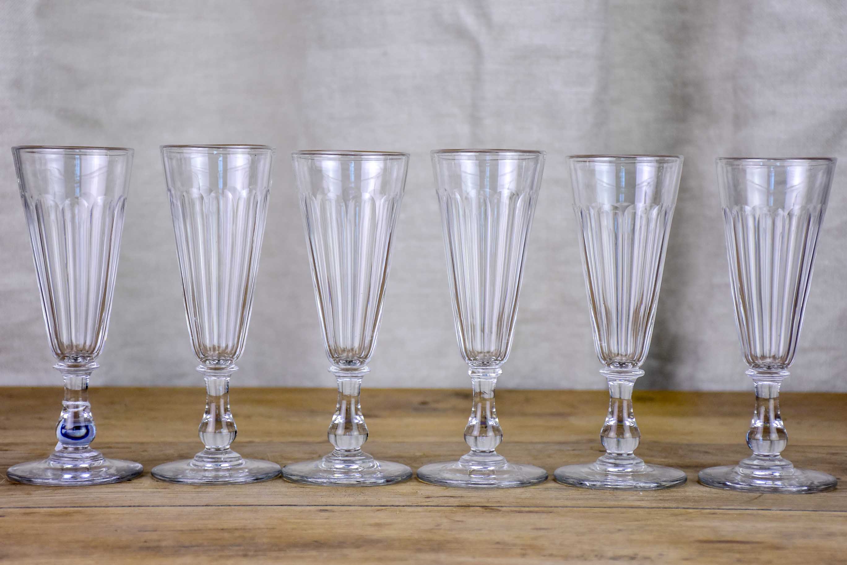 Six antique Baccarat champagne flutes