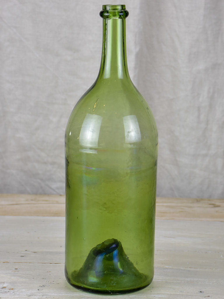 Antique French green glass bottle