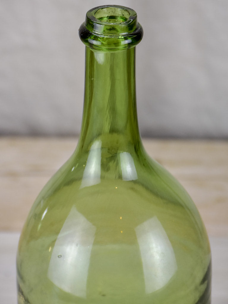 Antique French green glass bottle
