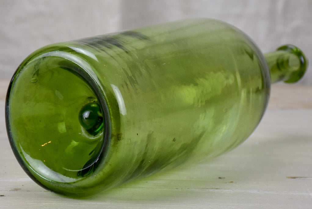 Antique French green glass bottle
