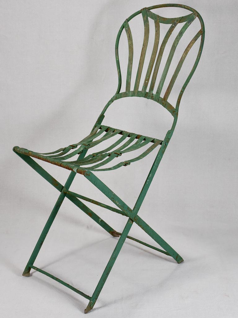 Pair of folding chairs from the military with green patina