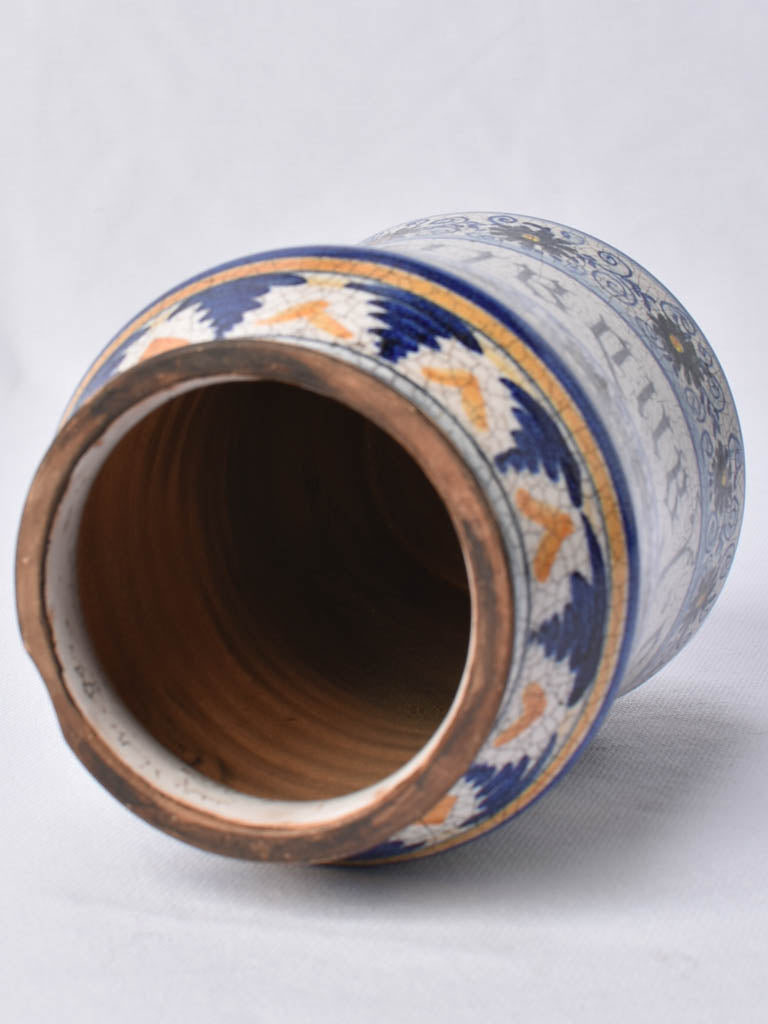 Intricate hand-painted design on antique jar