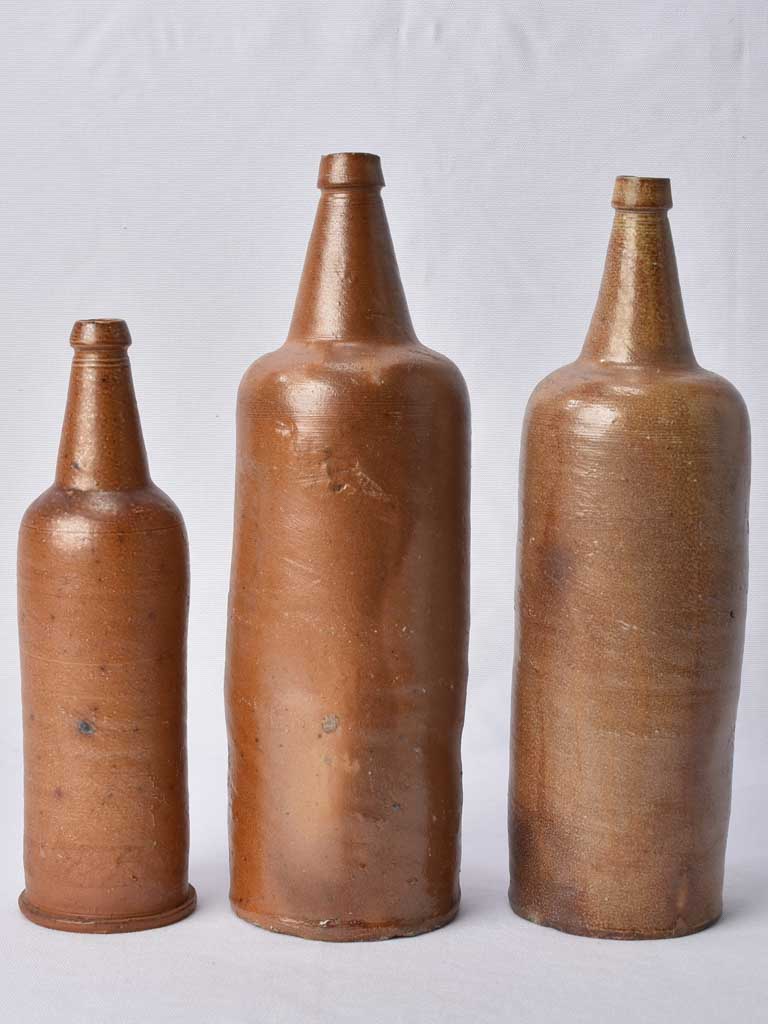 3 sandstone long bottles from Normandy 12¼"