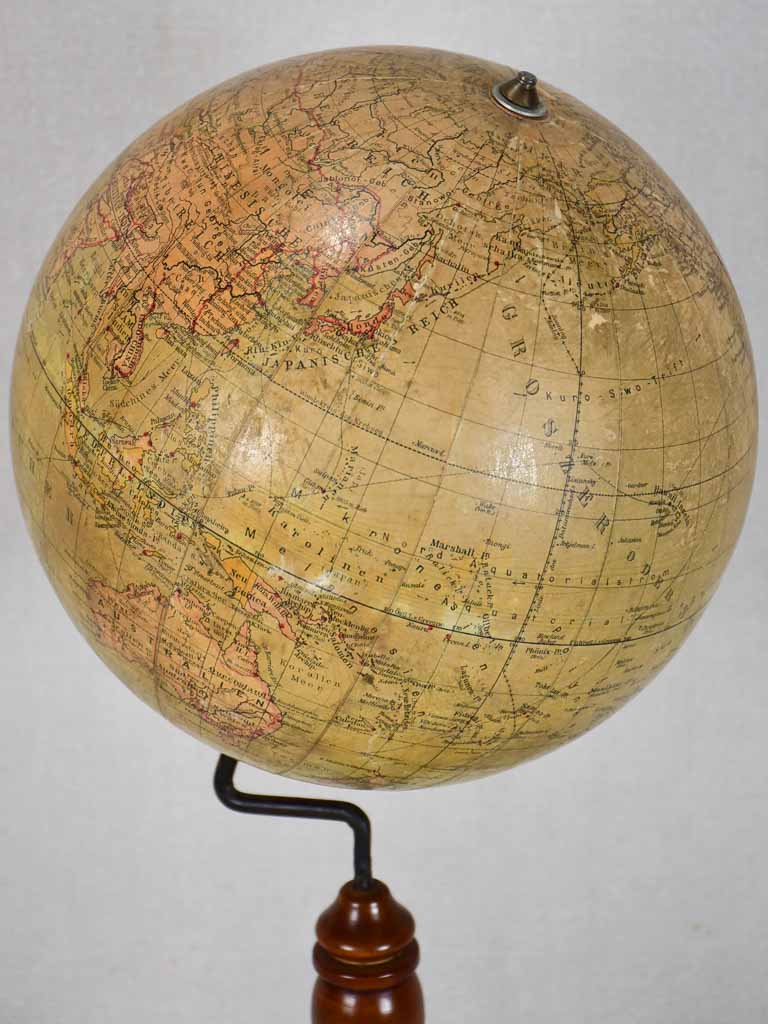Early 20th-century spinning world globe on wooden stand 20"