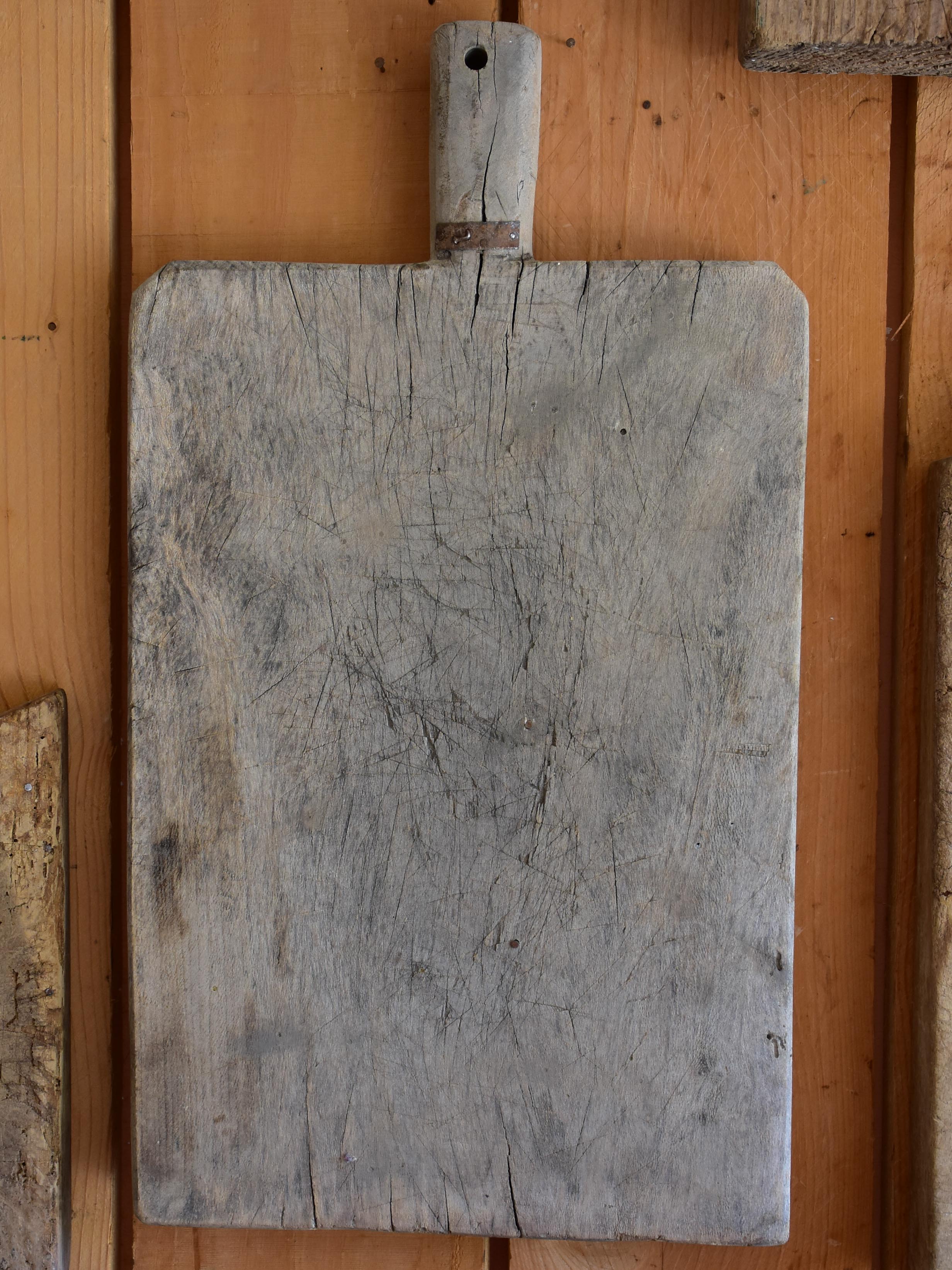 Antique French cutting board with beveled corners and grey timber